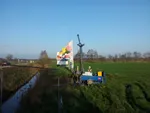 Werkzaamheden bij molen aan het water